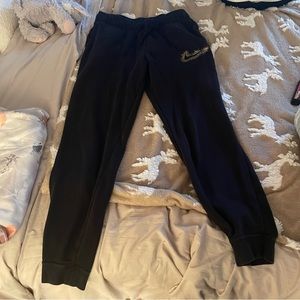 Nike sweatpants! Worn once and didn’t fit. Black with gold nike sign! Love them